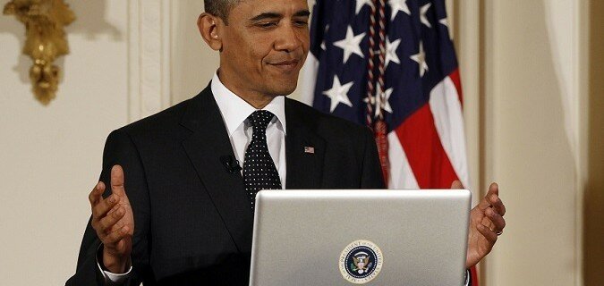 File photo of U.S. President Barack Obama reacting after tweeting at the White House in Washington